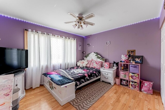 bedroom with light wood-style floors and ceiling fan