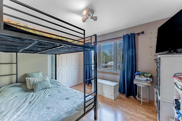 bedroom featuring light wood-style floors