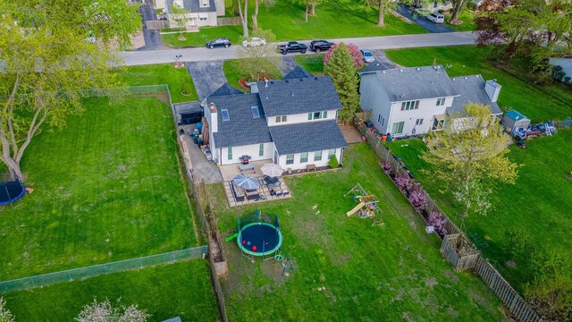 birds eye view of property with a residential view