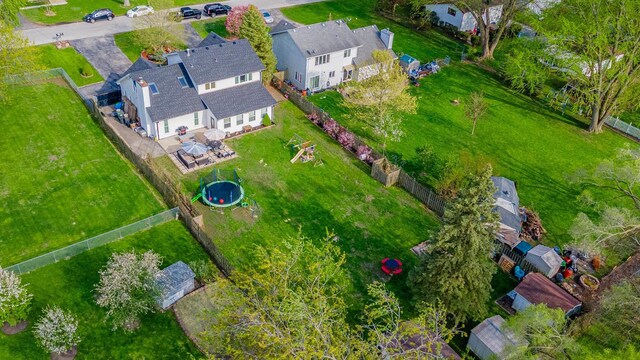 birds eye view of property with a residential view