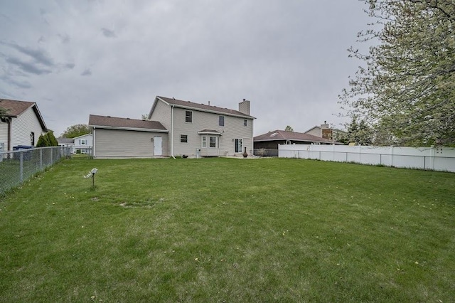 227 N Hickory St, Cortland, IL 60112 - rear view of property with a chimney