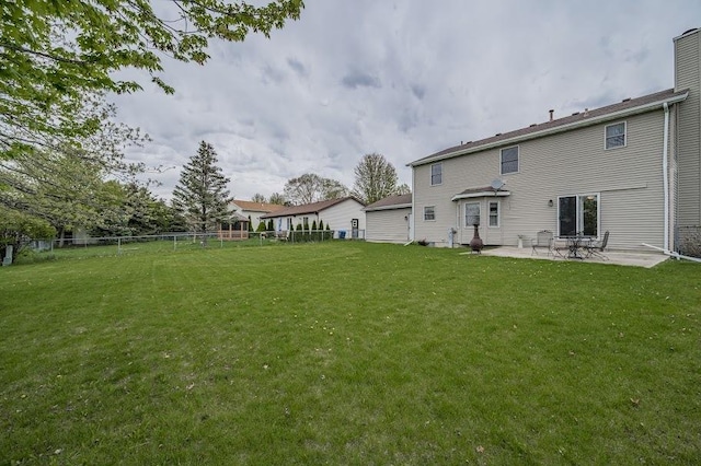 227 N Hickory St, Cortland, IL 60112 - back of property with a patio area