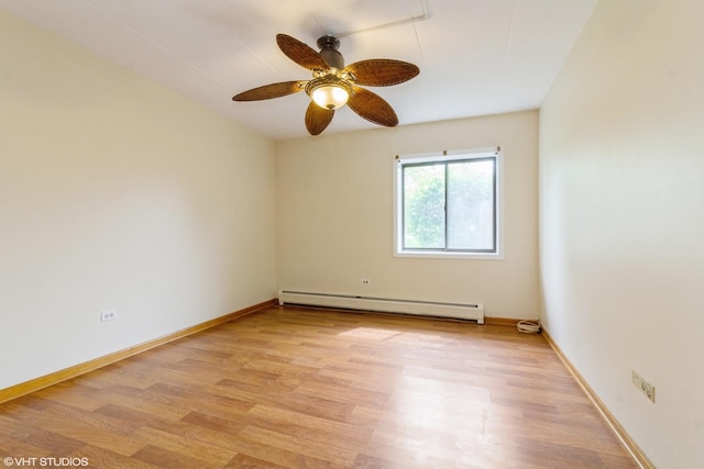empty room featuring baseboards, a ceiling fan, light wood-style flooring, and baseboard heating