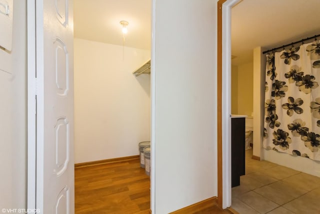 interior space featuring baseboards