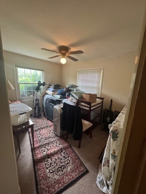 carpeted bedroom featuring a ceiling fan