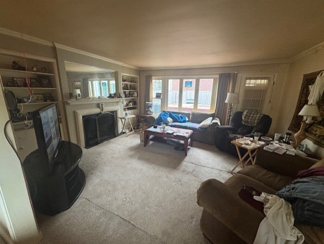 living room with ornamental molding, carpet, and a fireplace