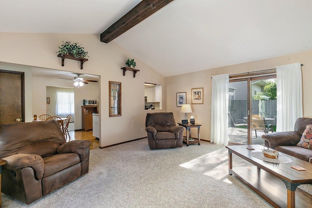 2206 Highland Dr, Sycamore, IL 60178 - living room with light colored carpet, ceiling fan, beam ceiling, baseboards, and high vaulted ceiling