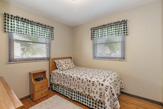 2206 Highland Dr, Sycamore, IL 60178 - bedroom featuring multiple windows, wood finished floors, and baseboards