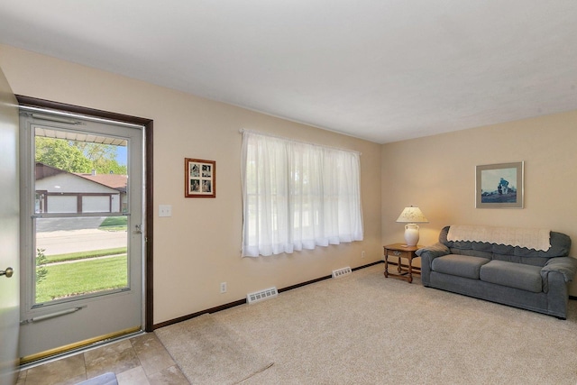 2206 Highland Dr, Sycamore, IL 60178 - carpeted living area with healthy amount of natural light and baseboards