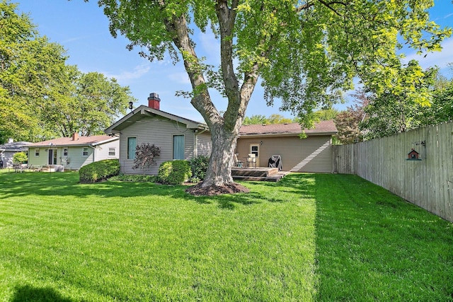 2206 Highland Dr, Sycamore, IL 60178 - rear view of house featuring a chimney and a wooden deck