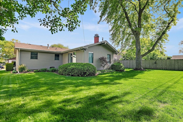 2206 Highland Dr, Sycamore, IL 60178 - rear view of property with a chimney