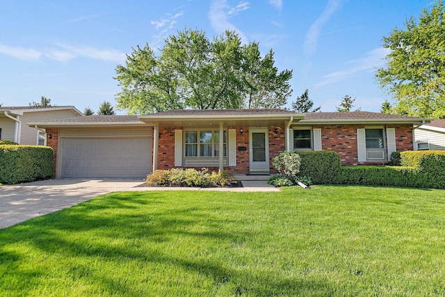 2206 Highland Dr, Sycamore, IL 60178 - ranch-style house featuring brick siding, an attached garage, a front yard, and concrete driveway