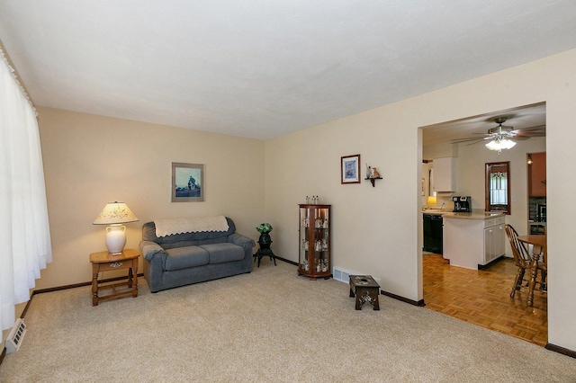 2206 Highland Dr, Sycamore, IL 60178 - living area with light carpet, baseboards, and ceiling fan