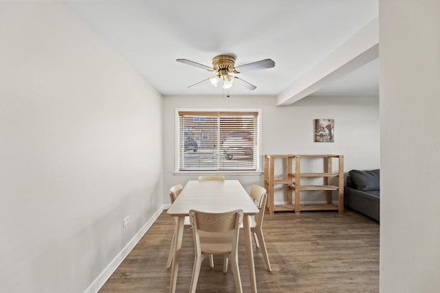 dining area with baseboards, ceiling fan, and wood finished floors