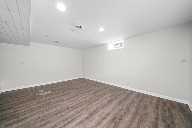 unfurnished room featuring recessed lighting, baseboards, visible vents, and wood finished floors