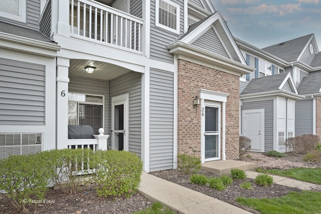 2215 Aurora Dr Unit 6, Pingree Grove, IL 60140 - entrance to property featuring a balcony and brick siding
