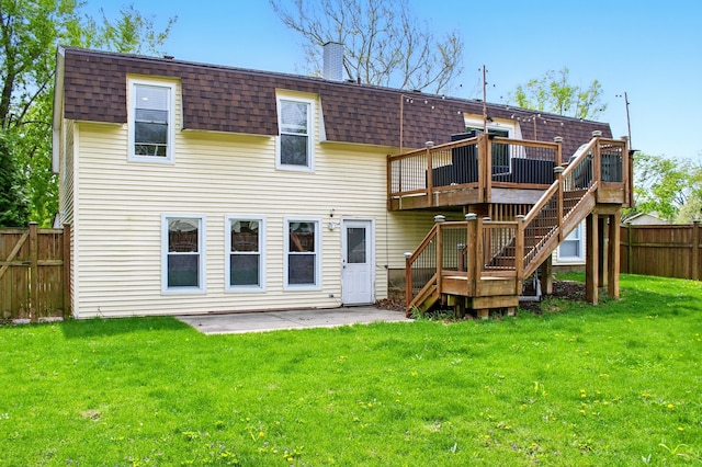 back of house with fence private yard, roof with shingles, a deck, and a patio