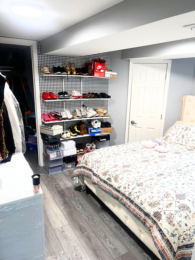 bedroom featuring a closet and wood finished floors