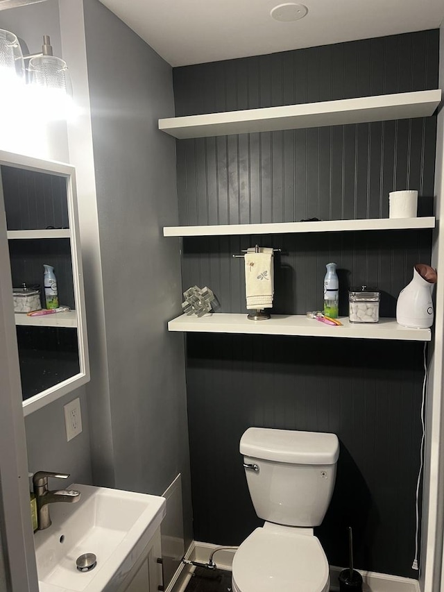 bathroom with toilet and a sink