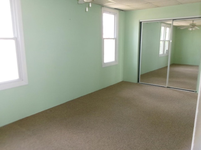 unfurnished bedroom with a closet and carpet
