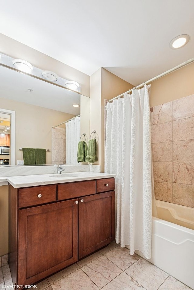 bathroom with vanity and shower / bath combo