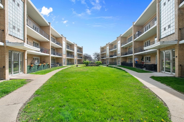 view of property's community with a yard