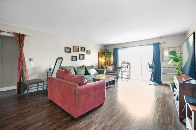 living room featuring baseboards and dark wood finished floors
