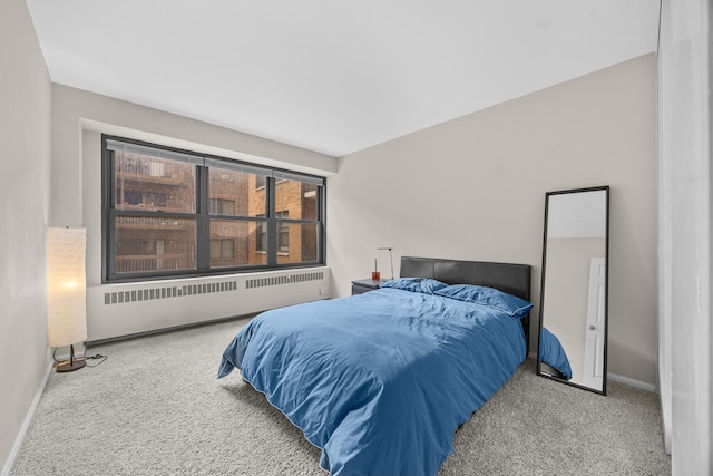 6118 N Sheridan Rd Unit 304, Chicago, IL 60660 - carpeted bedroom with baseboards and radiator heating unit