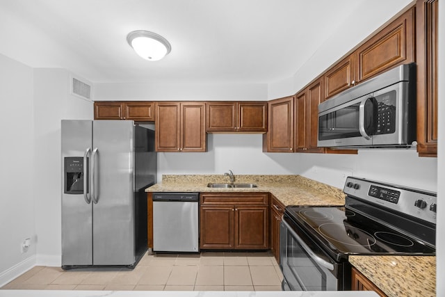 6118 N Sheridan Rd Unit 304, Chicago, IL 60660 - kitchen with a sink, appliances with stainless steel finishes, light tile patterned floors, and light stone counters