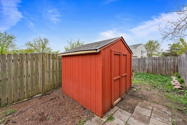 view of shed with a fenced backyard
