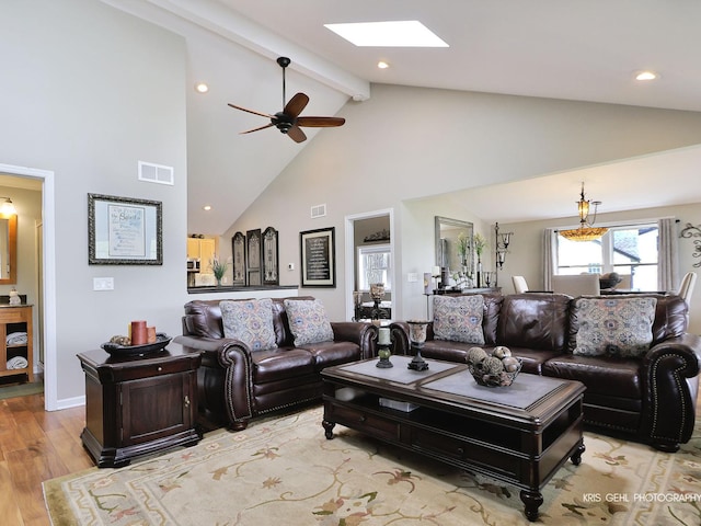 2601 N Villa Ln, Mchenry, IL 60051 - living area with a skylight, high vaulted ceiling, light wood-type flooring, beamed ceiling, and ceiling fan