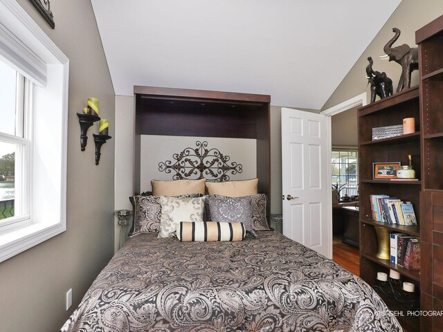 2601 N Villa Ln, Mchenry, IL 60051 - bedroom featuring vaulted ceiling and wood finished floors
