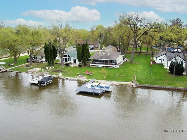 2601 N Villa Ln, Mchenry, IL 60051 - dock area with boat lift, a water view, and a yard