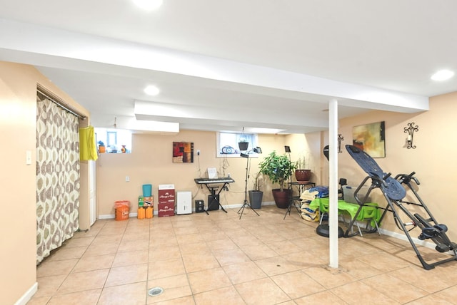 workout area featuring recessed lighting, baseboards, and a wealth of natural light