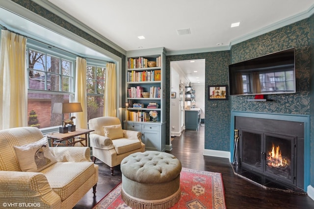 2334 Central Park Ave, Evanston, IL 60201 - living area featuring crown molding, dark wood-style flooring, baseboards, wallpapered walls, and a tile fireplace