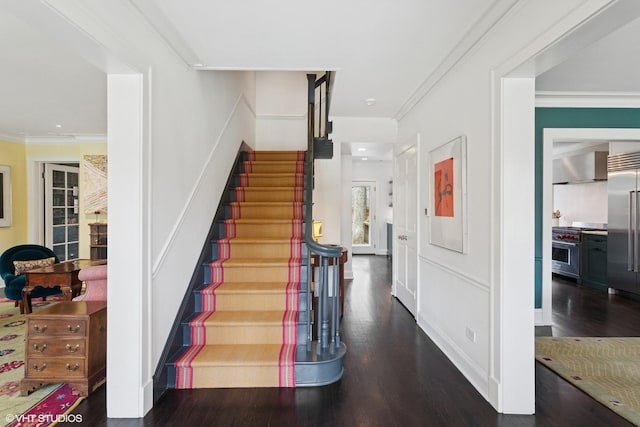 2334 Central Park Ave, Evanston, IL 60201 - stairs featuring crown molding, recessed lighting, and wood finished floors
