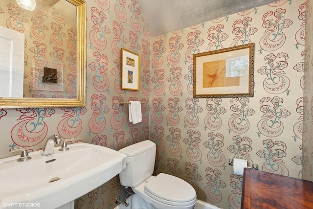 2334 Central Park Ave, Evanston, IL 60201 - half bath with toilet, wallpapered walls, and a sink