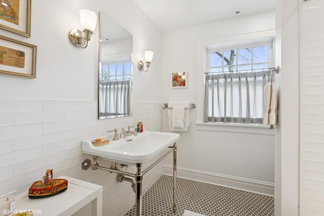 2334 Central Park Ave, Evanston, IL 60201 - bathroom with plenty of natural light, a sink, wainscoting, and tile walls