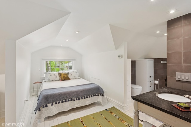 2334 Central Park Ave, Evanston, IL 60201 - bedroom with a sink, baseboards, recessed lighting, and lofted ceiling