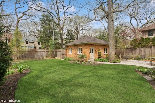 2334 Central Park Ave, Evanston, IL 60201 - view of yard featuring a fenced backyard, a patio area, and an outbuilding
