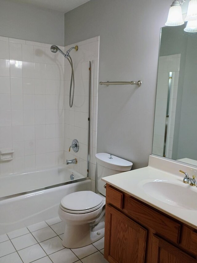 full bathroom featuring toilet, bathing tub / shower combination, tile patterned flooring, and vanity