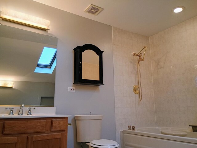 full bath with shower / bath combination, visible vents, a skylight, vanity, and toilet
