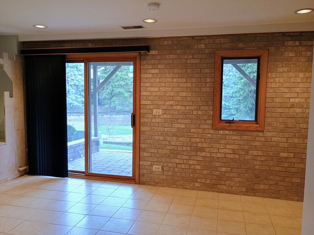 interior space with recessed lighting, brick wall, and visible vents