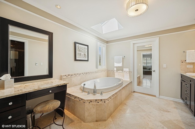 full bath featuring a skylight, plenty of natural light, a bath, and vanity