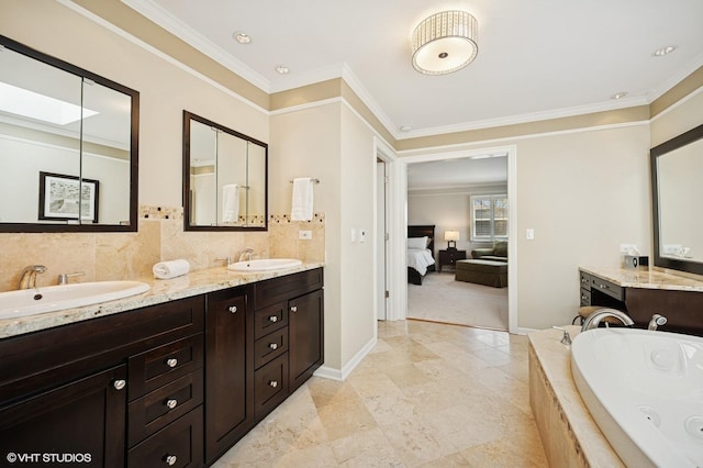 full bathroom with a sink, ornamental molding, a tub with jets, and connected bathroom