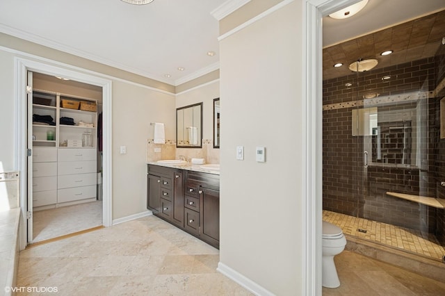 bathroom featuring double vanity, toilet, tile patterned floors, a shower stall, and a sink