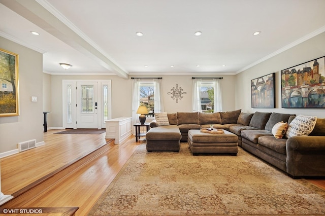 living room with recessed lighting, visible vents, ornamental molding, and light wood-type flooring
