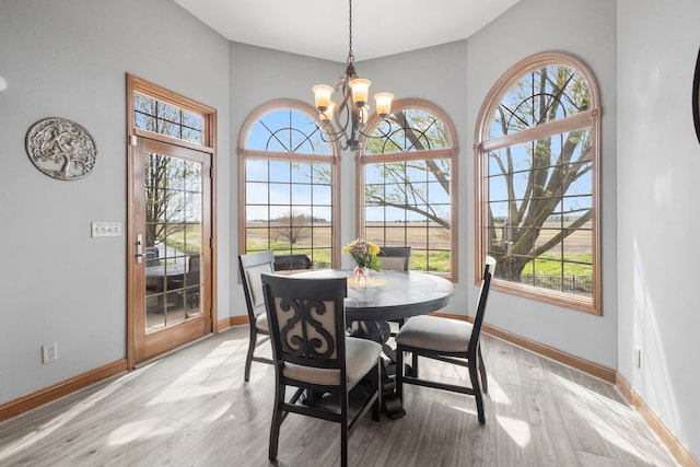 400 Rock Creek Dr, Manteno, IL 60950 - dining area with baseboards, a chandelier, and a healthy amount of sunlight