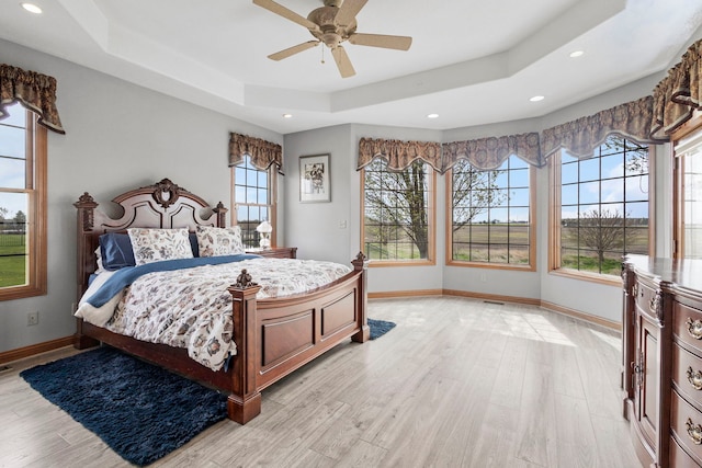 400 Rock Creek Dr, Manteno, IL 60950 - bedroom featuring a ceiling fan, a raised ceiling, baseboards, light wood finished floors, and recessed lighting