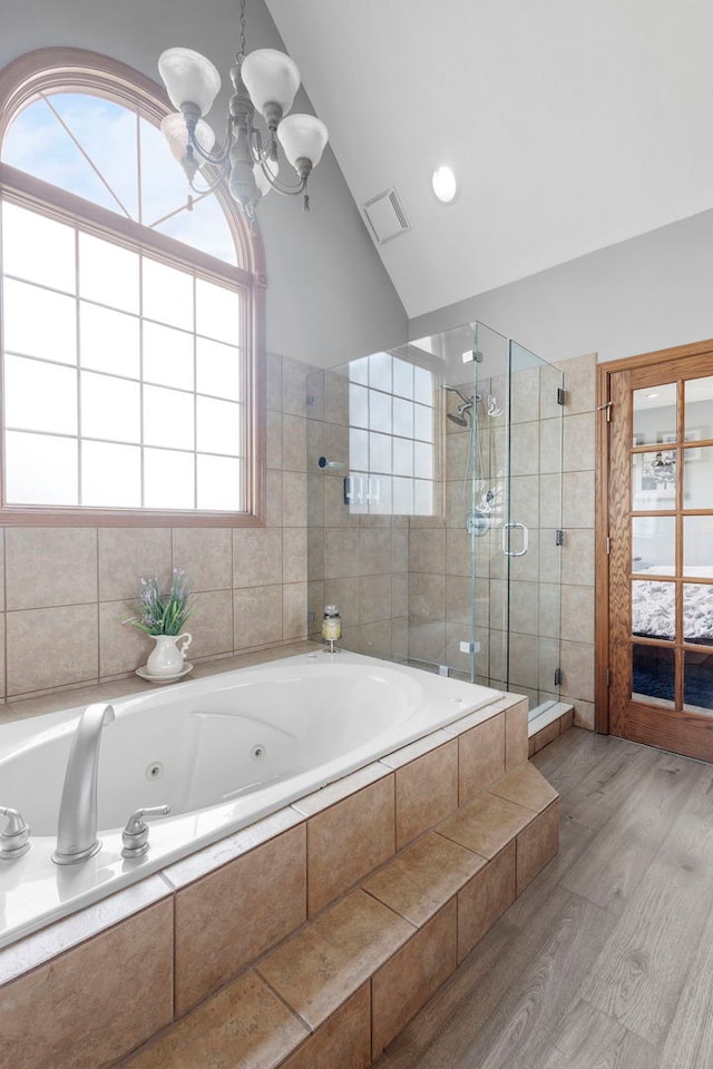 400 Rock Creek Dr, Manteno, IL 60950 - bathroom with visible vents, a whirlpool tub, a stall shower, and wood finished floors